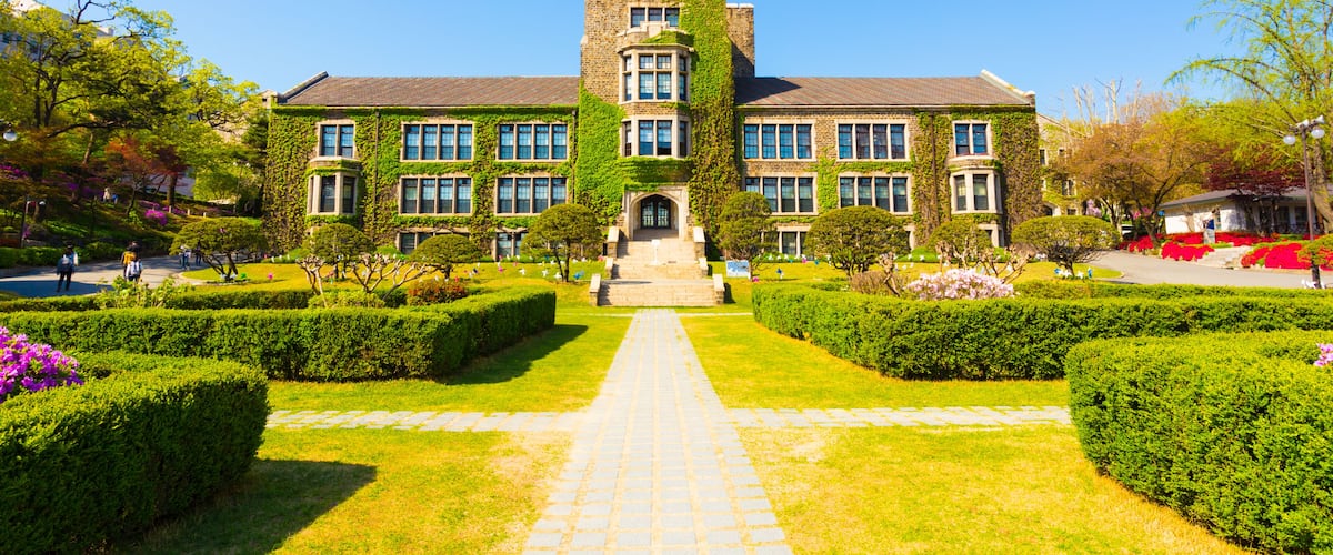 Grassy walking path leading to ivy covered main building at venerable Yonsei University in Sinchon, Seoul, South Korea. Horizontal, Shutterstock ID 549571837, SF SSA Case with Manager Approval: Case 0
