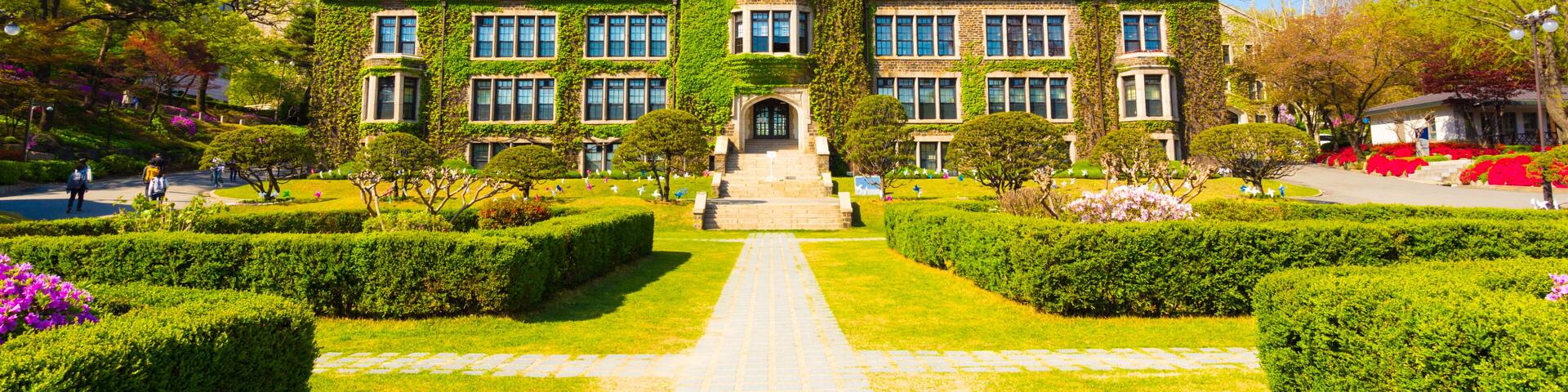 Grassy walking path leading to ivy covered main building at venerable Yonsei University in Sinchon, Seoul, South Korea. Horizontal, Shutterstock ID 549571837, SF SSA Case with Manager Approval: Case 0