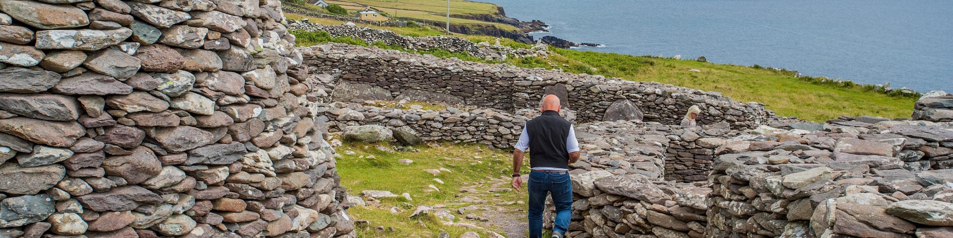 Fahan BeeHive Huts featuring heritage elements and building ruins as well as an individual male