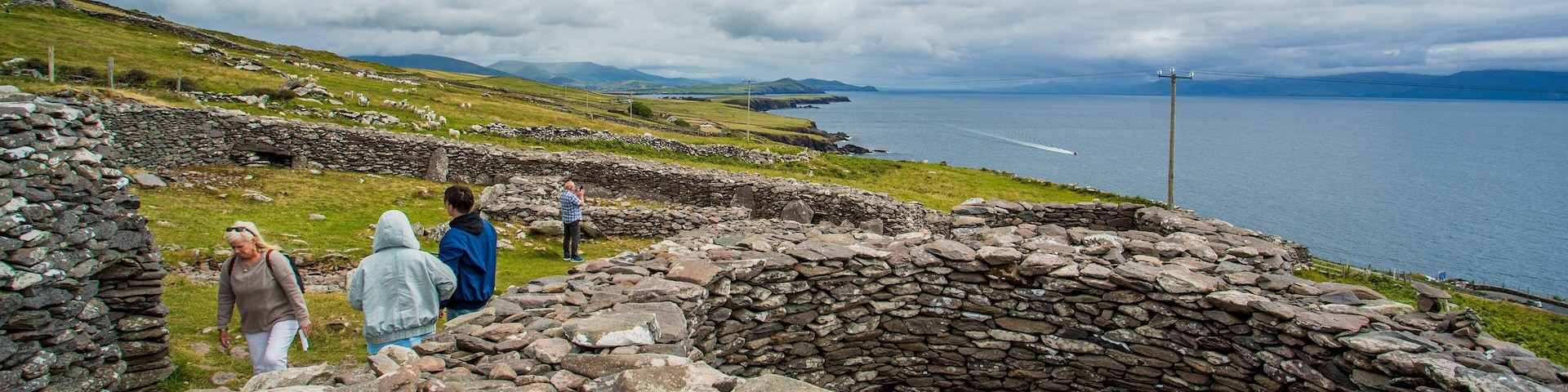Fahan BeeHive Huts showing heritage elements as well as a small group of people