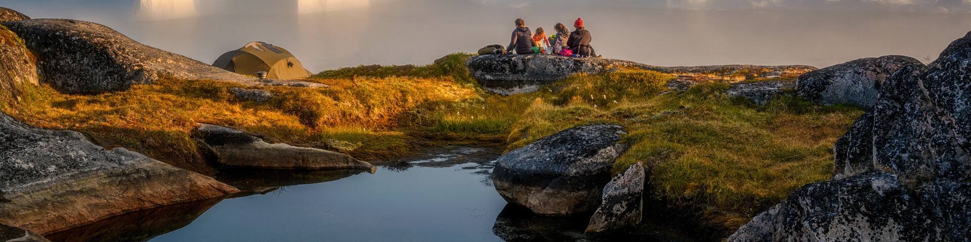 Greenland Ilulissat color glaciers sea ocean fjord, sitting, picnic, relax by the sea with icebergs in the fog, in the haze