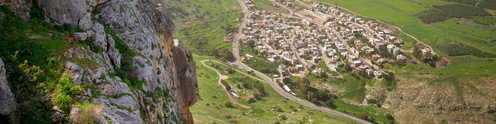 Mount Arbel which includes landscape views, tranquil scenes and a small town or village