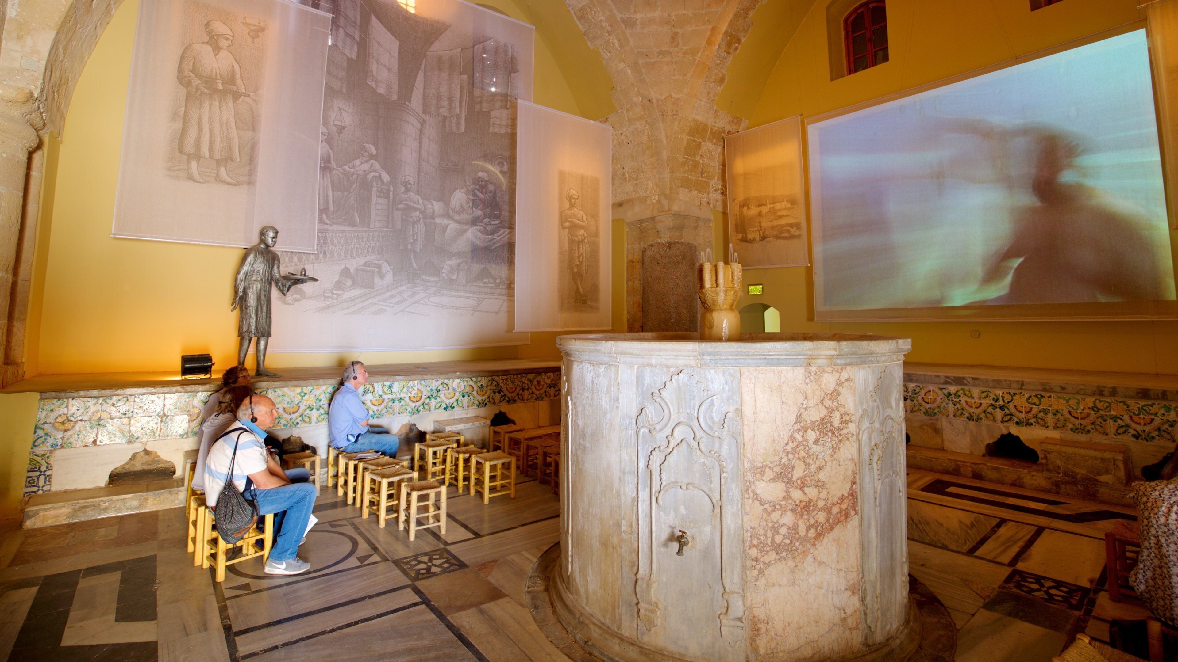 Hamam al- Basha Turkish Bath which includes interior views as well as a small group of people