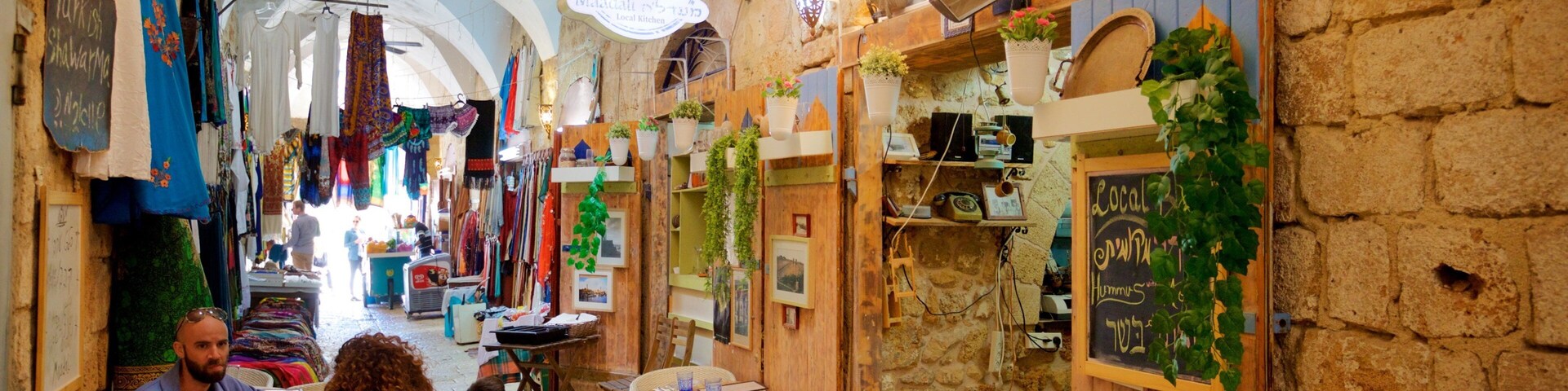 Turkish Bazaar featuring cafe lifestyle as well as a family