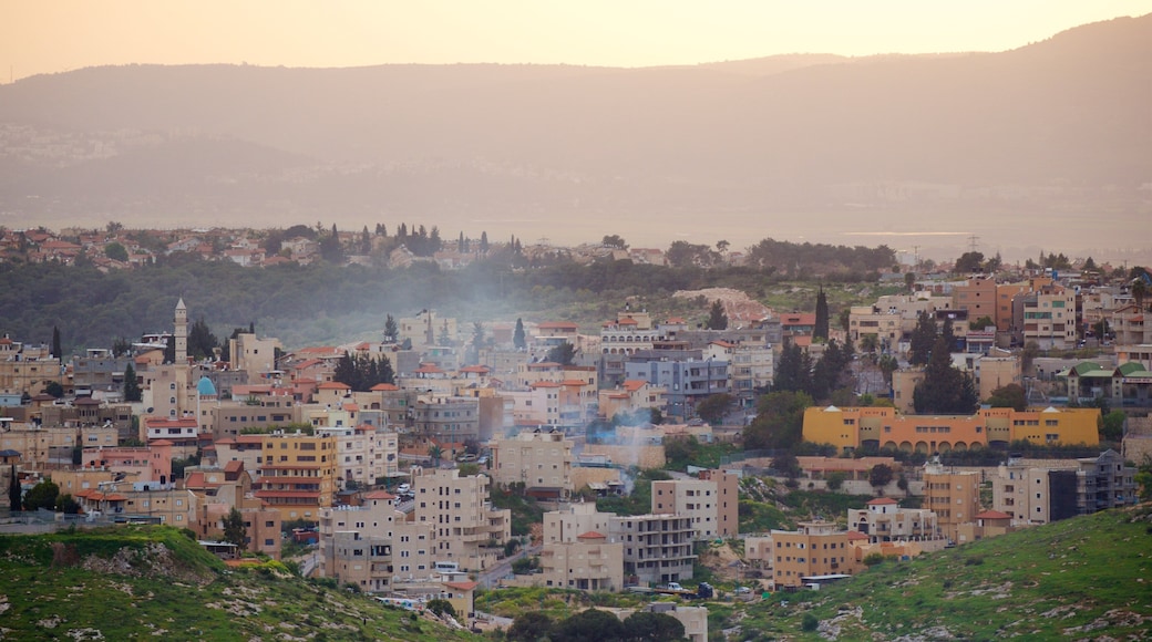 Mount of Precipice which includes a small town or village, landscape views and a sunset