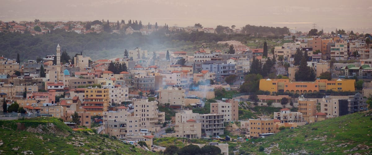 Mount of Precipice which includes a small town or village, landscape views and a sunset
