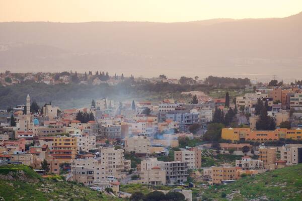 Mount of Precipice which includes a small town or village, landscape views and a sunset