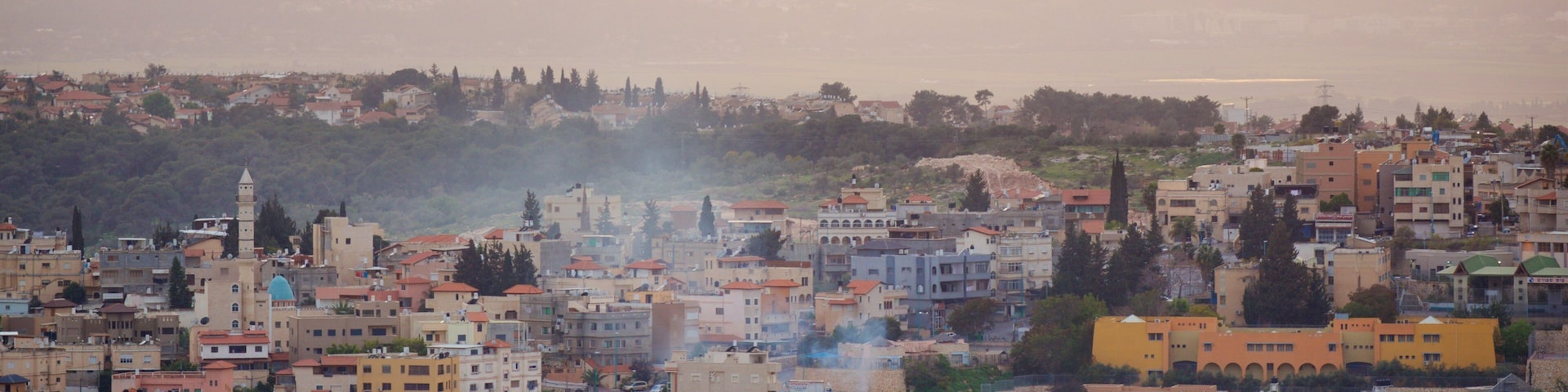 Mount of Precipice which includes a small town or village, landscape views and a sunset