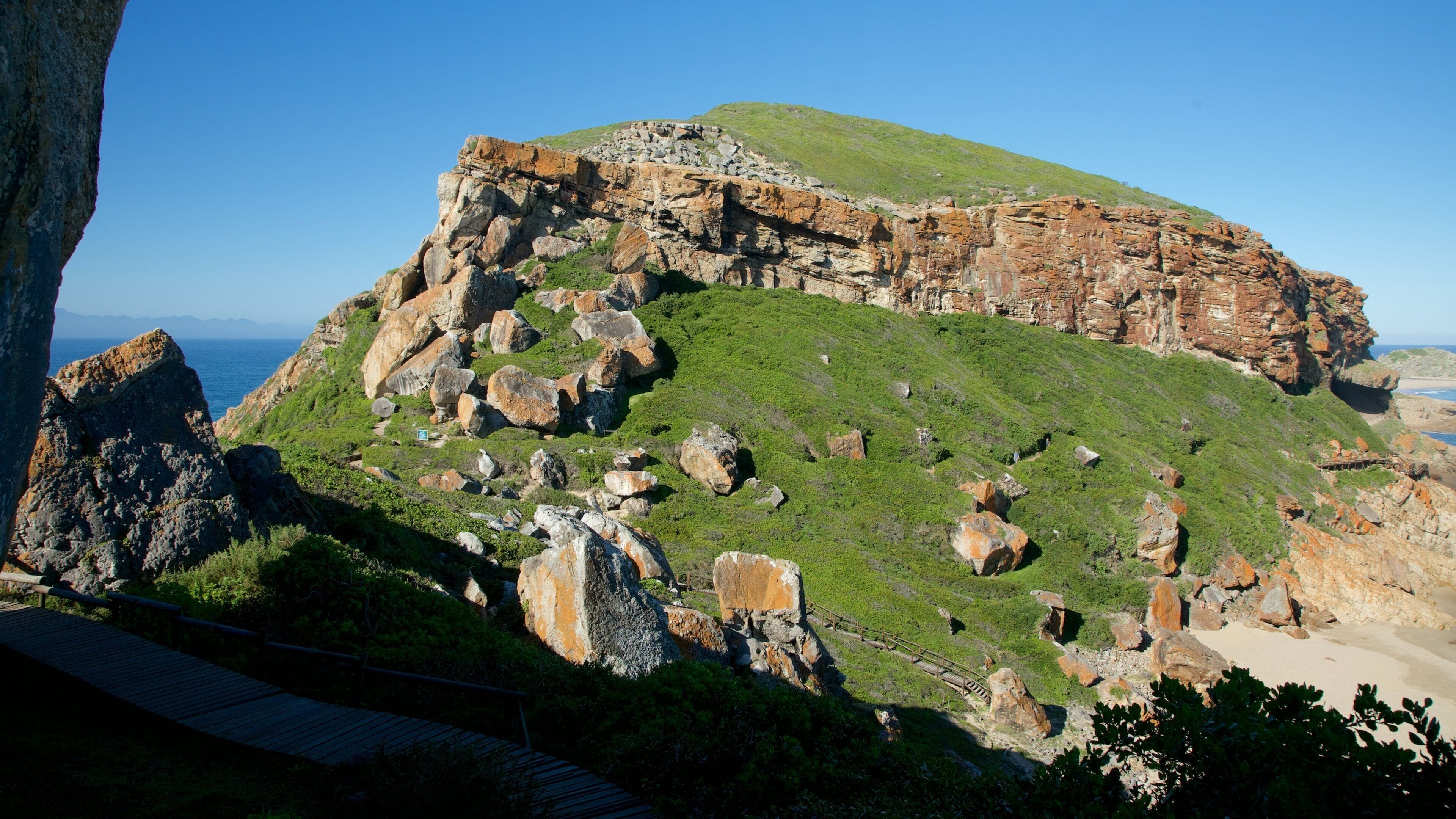 Robberg Nature Reserve featuring rocky coastline and general coastal views