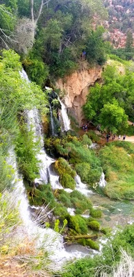 There is a short walk to the falls from the campsites. Way back in the day it was just a river with a high concentration of calcium. Over the years, the calcium built up and created the falls and some neat caves! It's a fun place to explore!!