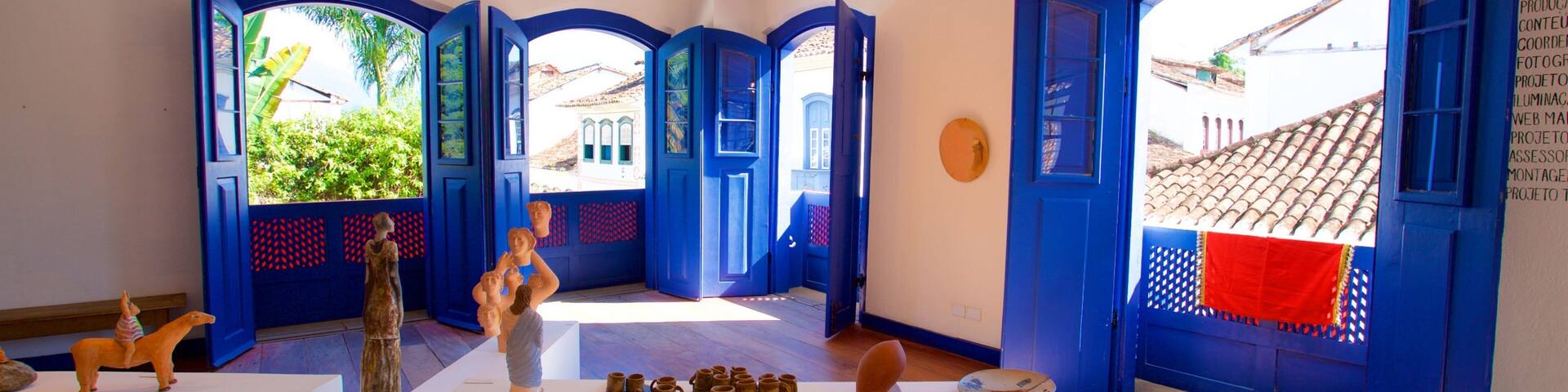 An art gallery with blue doors and white walls.