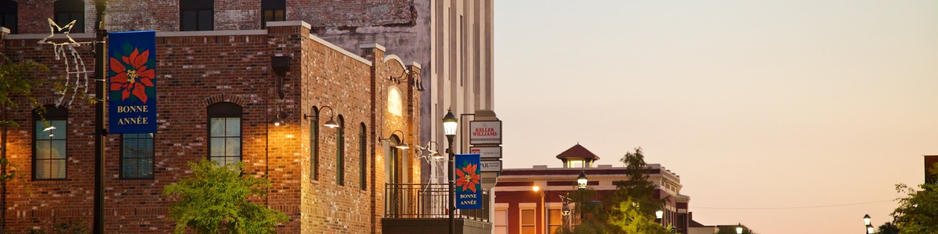 Lake Charles Historic District featuring a sunset