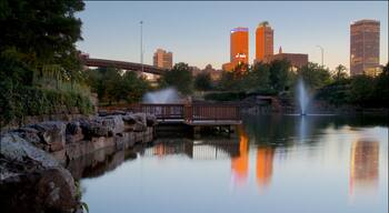 Centennial Park featuring a river or creek, a city and a sunset
