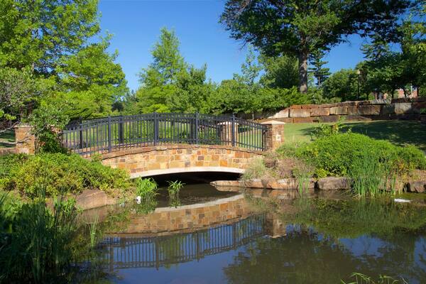 Centennial Park featuring a bridge, a park and a river or creek