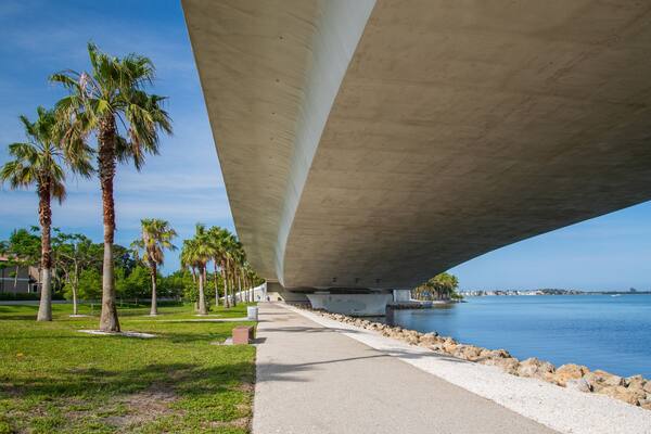 Causeway Park which includes a park, general coastal views and a bridge