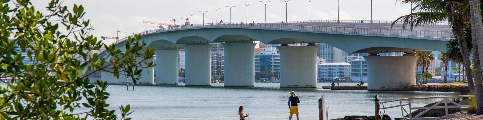 Causeway Park which includes a bridge and a river or creek as well as a couple
