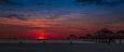 Beautiful bright sunset and colorful sky with clouds. Gulf of Mexico. Florida Clearwater Beach. Fishing Pier 60