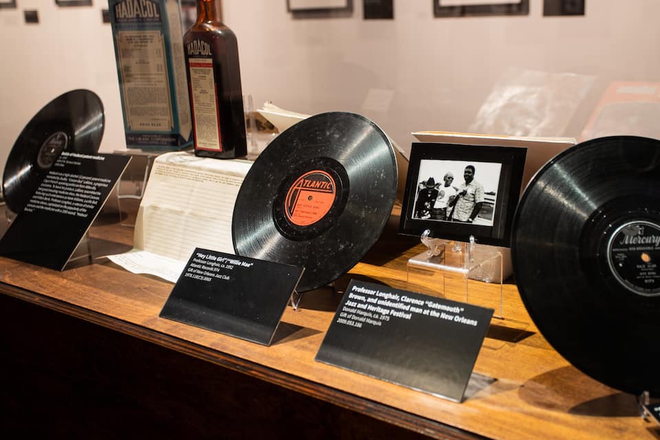 A display of vinyl records with accompanying plaques.