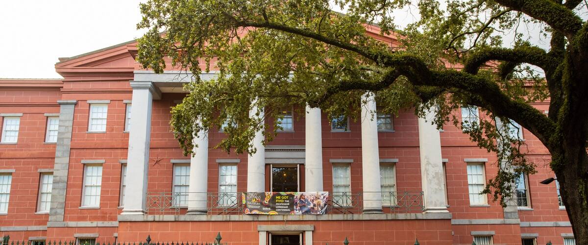 New Orleans Jazz Museum featuring signage and heritage architecture