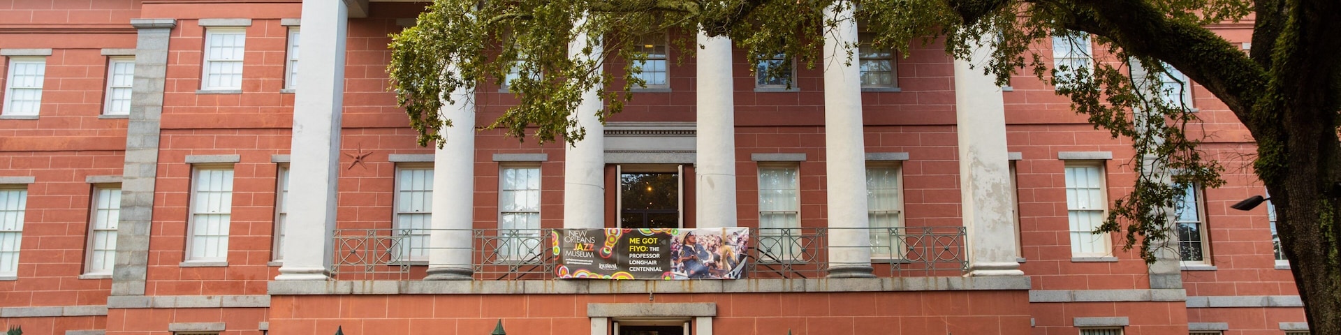 New Orleans Jazz Museum featuring signage and heritage architecture