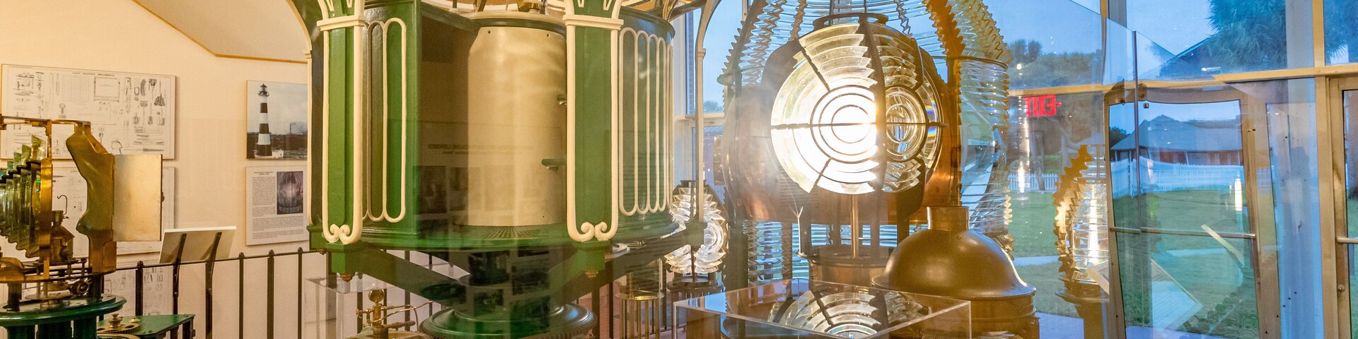 Ponce de Leon Inlet Lighthouse and Museum featuring a lighthouse and interior views