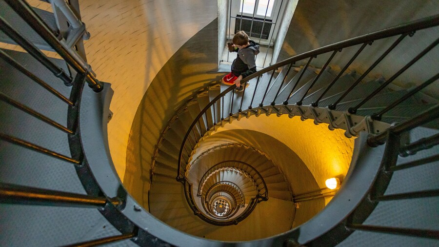 Ponce de Leon Inlet Lighthouse and Museum featuring interior views and a lighthouse