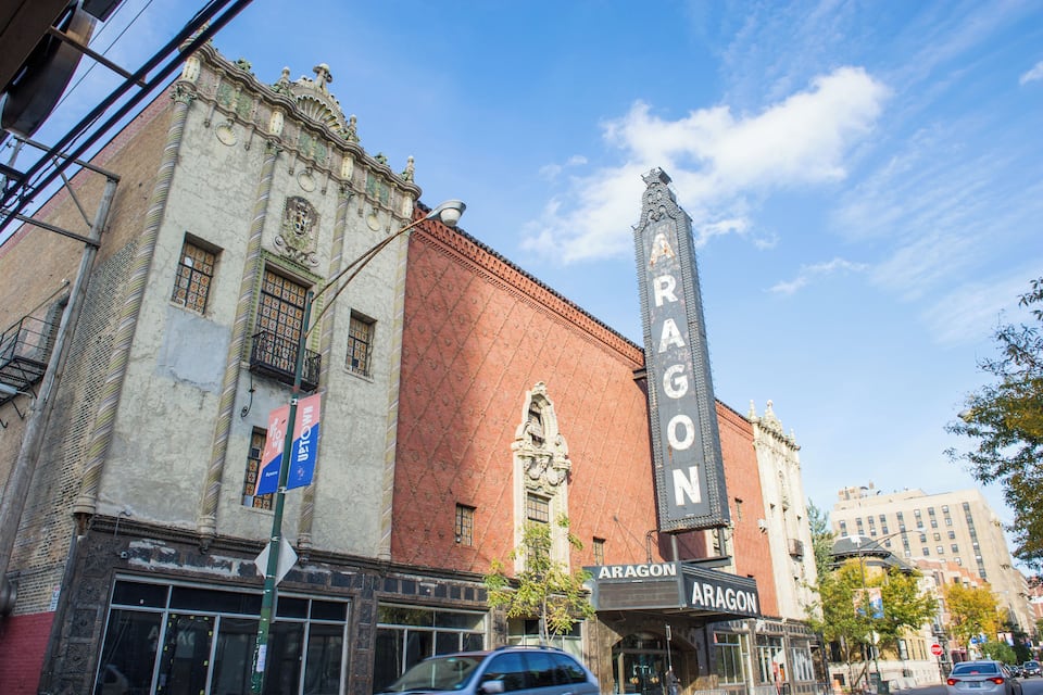 A historic theater with ornate architecture and a prominent marquee.