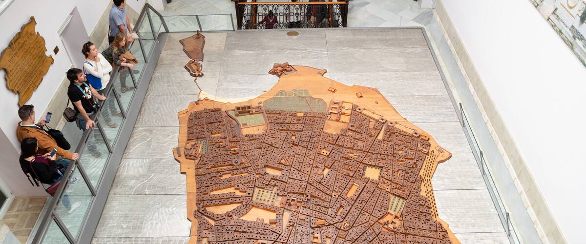 Cortes Museum featuring interior views as well as a small group of people