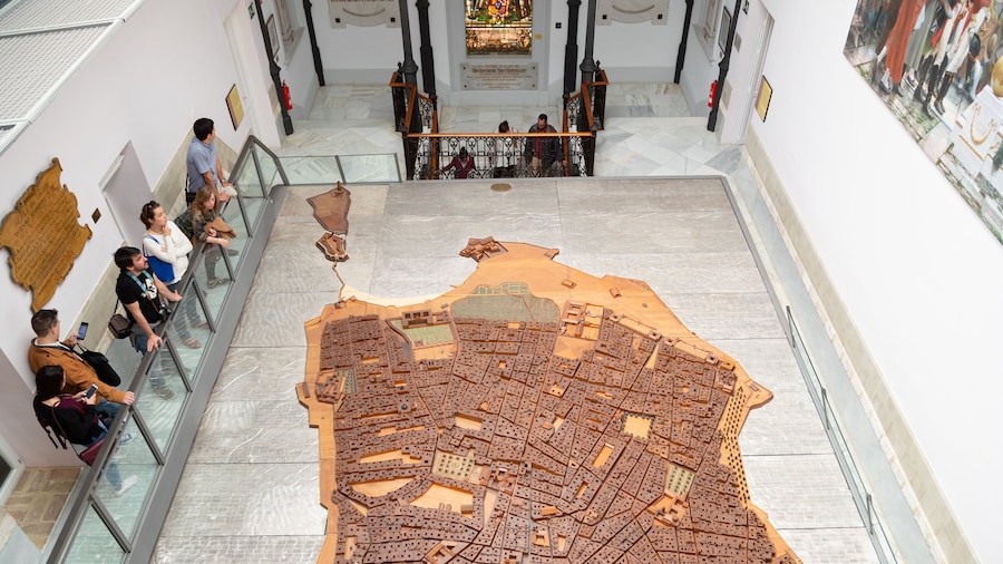 Cortes Museum featuring interior views as well as a small group of people