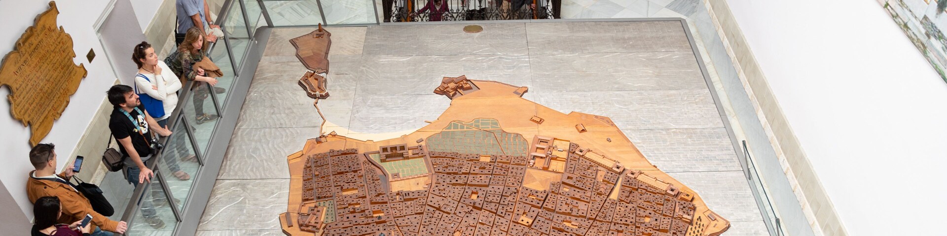 Cortes Museum featuring interior views as well as a small group of people