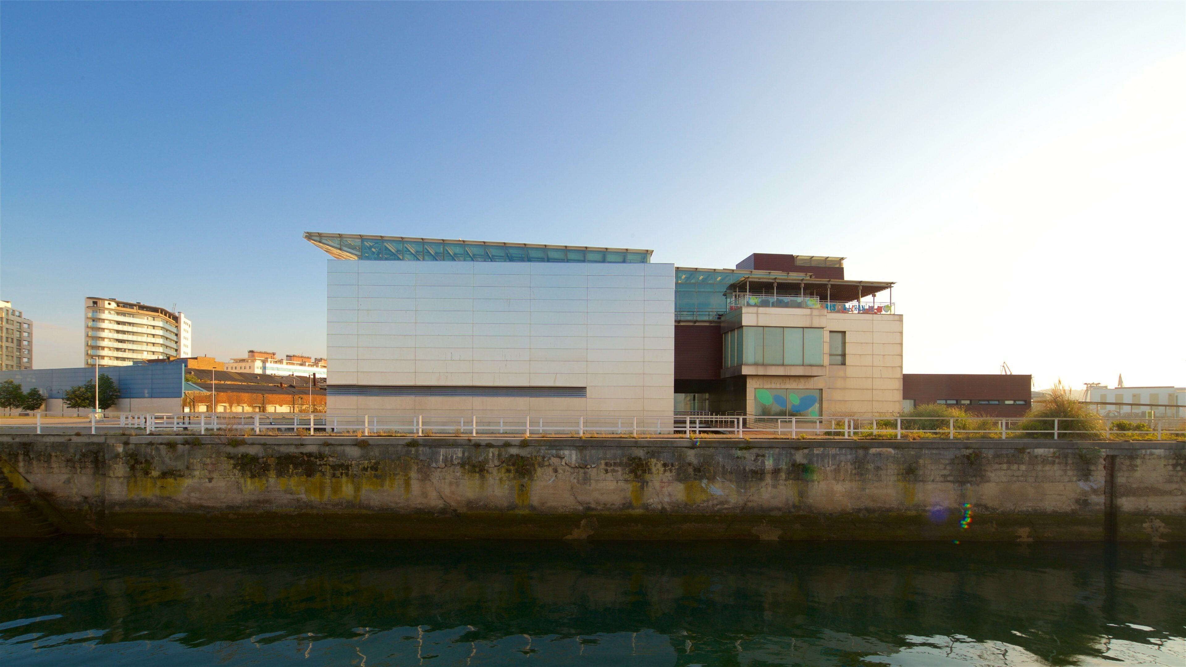 Aquarium of Gijon showing a sunset and a river or creek