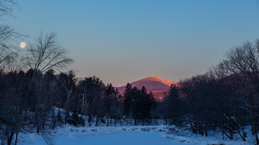 Sunrise hits Spaulding Mountain. This is in the Sugarloaf area, Spaulding is between Sugarloaf and the town of Kingfield. Photograph is looking north up the Carrabassett River in February of 2019.