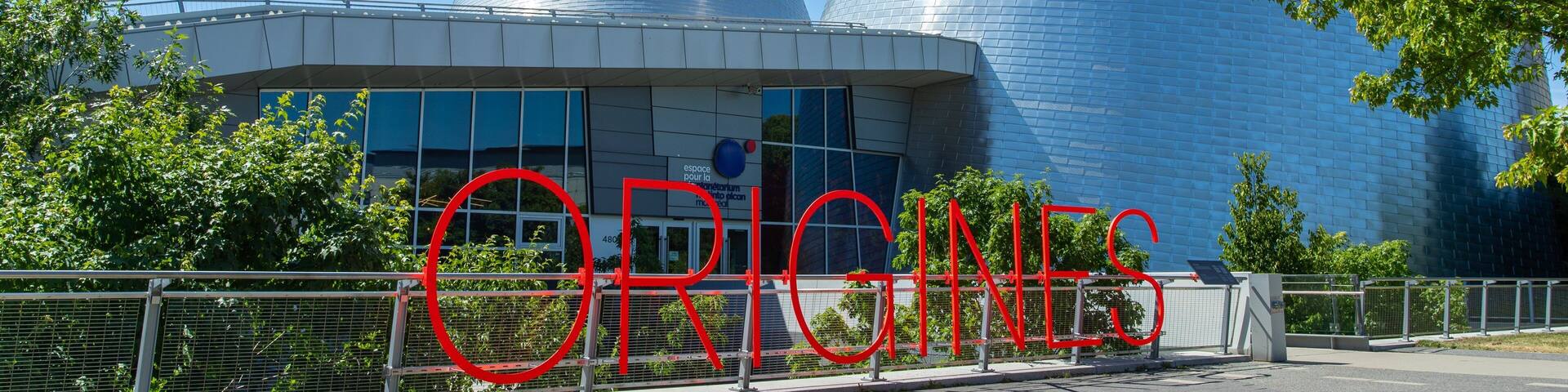Montreal Planetarium which includes signage and modern architecture