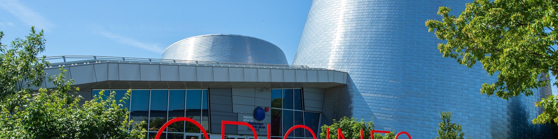 Montreal Planetarium which includes signage and modern architecture