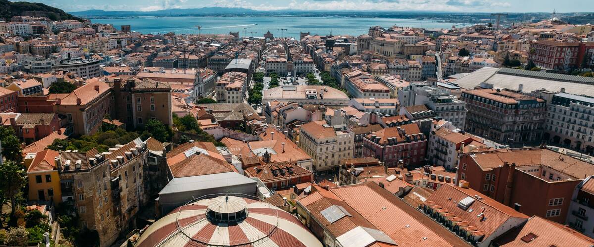 Aerial drone view of Baixa District in Lisbon, Portugal with major landmarks visible