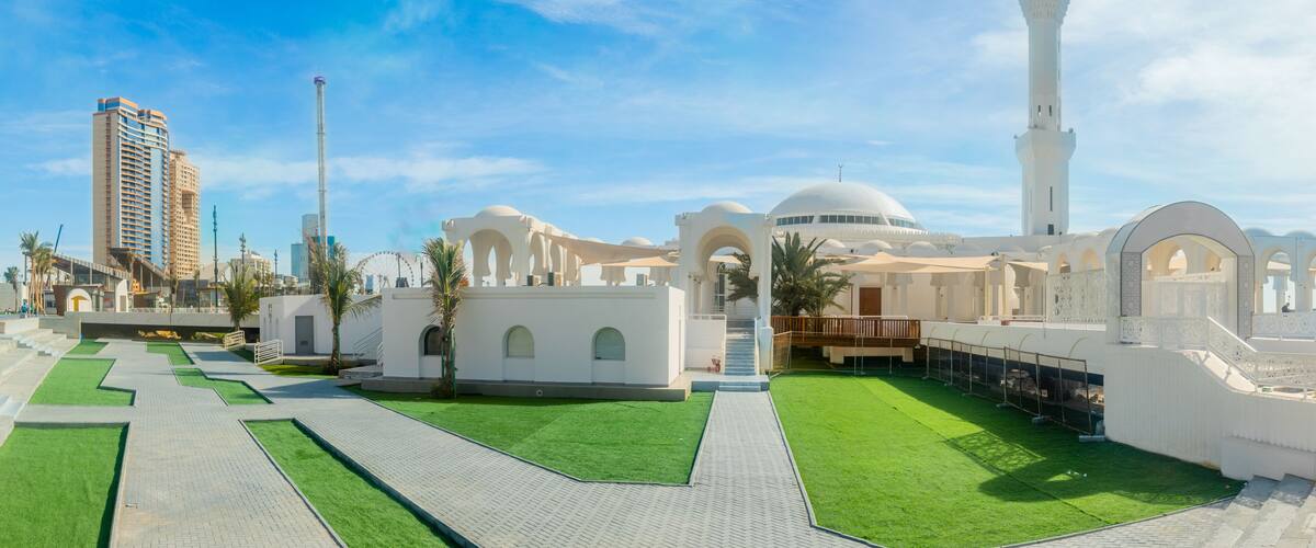 Alrahmah white mosque with city promenade in the background, Jeddah, Saudi Arabia