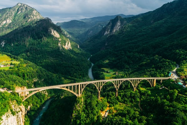 Aerial View of Durdevica Tara Arc Bridge in the Mountains, One of the Highest Automobile Bridges in Europe.
