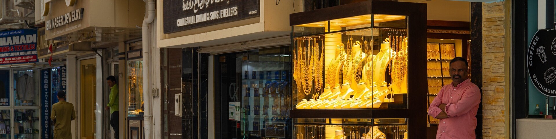 Gold Souq showing street scenes and a city as well as an individual male