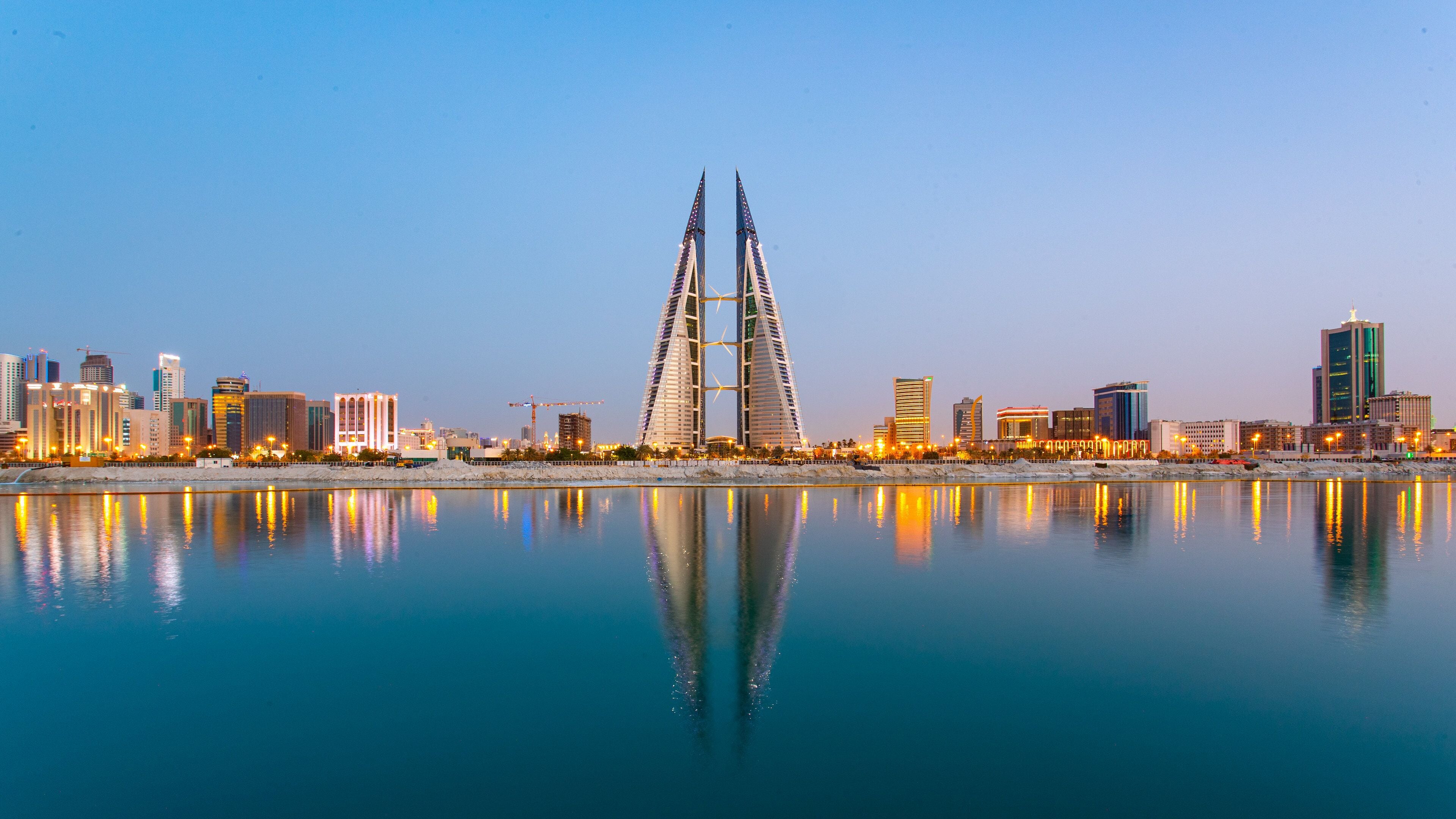 Bahrain World Trade Center featuring a city, a bay or harbor and modern architecture