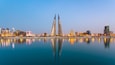 Bahrain World Trade Center featuring a city, a bay or harbor and modern architecture