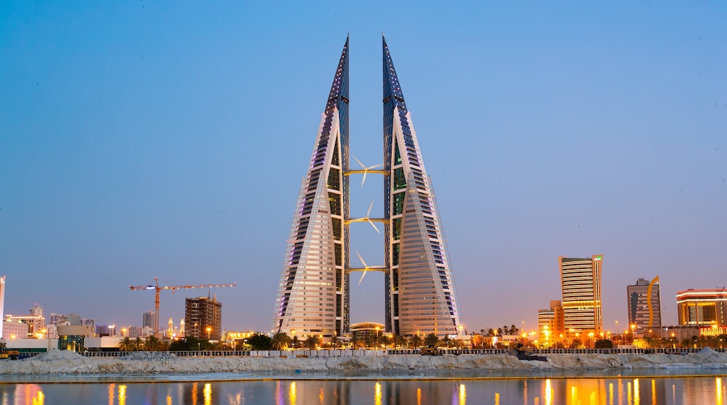 Bahrain World Trade Center which includes a city, modern architecture and night scenes