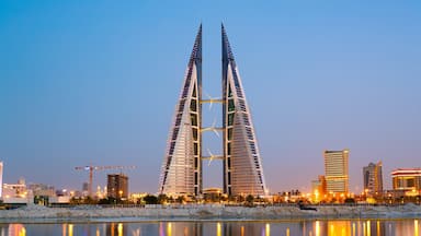 Bahrain World Trade Center which includes a city, modern architecture and night scenes