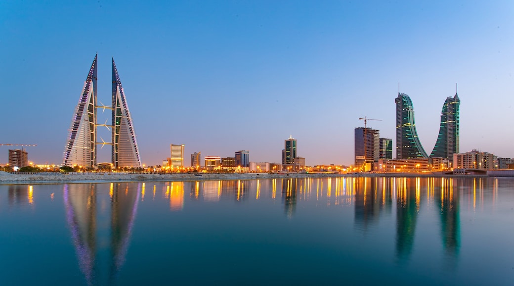 Bahrain World Trade Center showing modern architecture, a city and night scenes