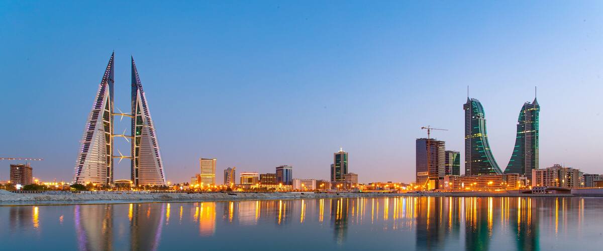 Bahrain World Trade Center showing modern architecture, a city and night scenes