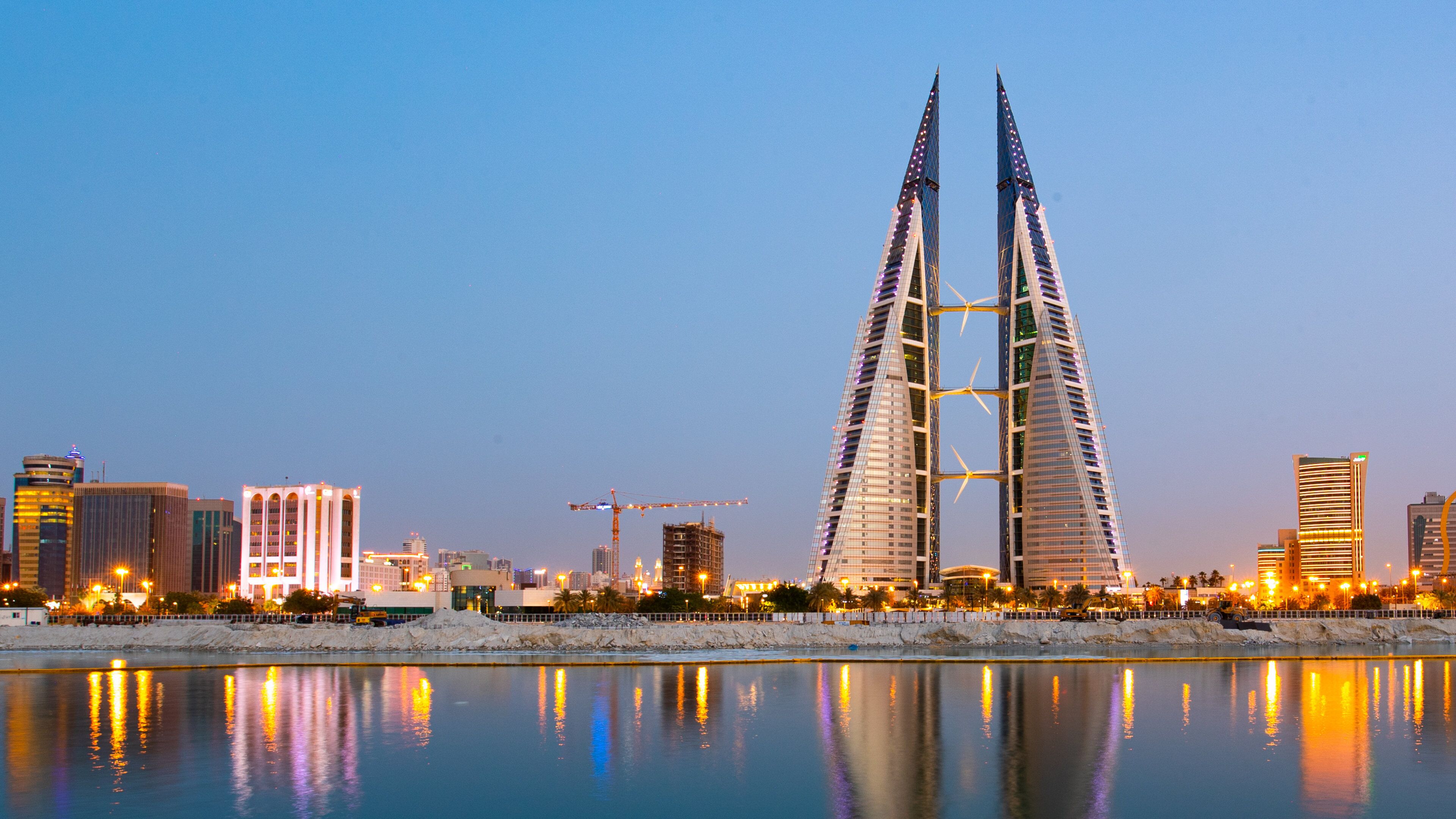 Bahrain World Trade Center showing a skyscraper, modern architecture and a bay or harbor