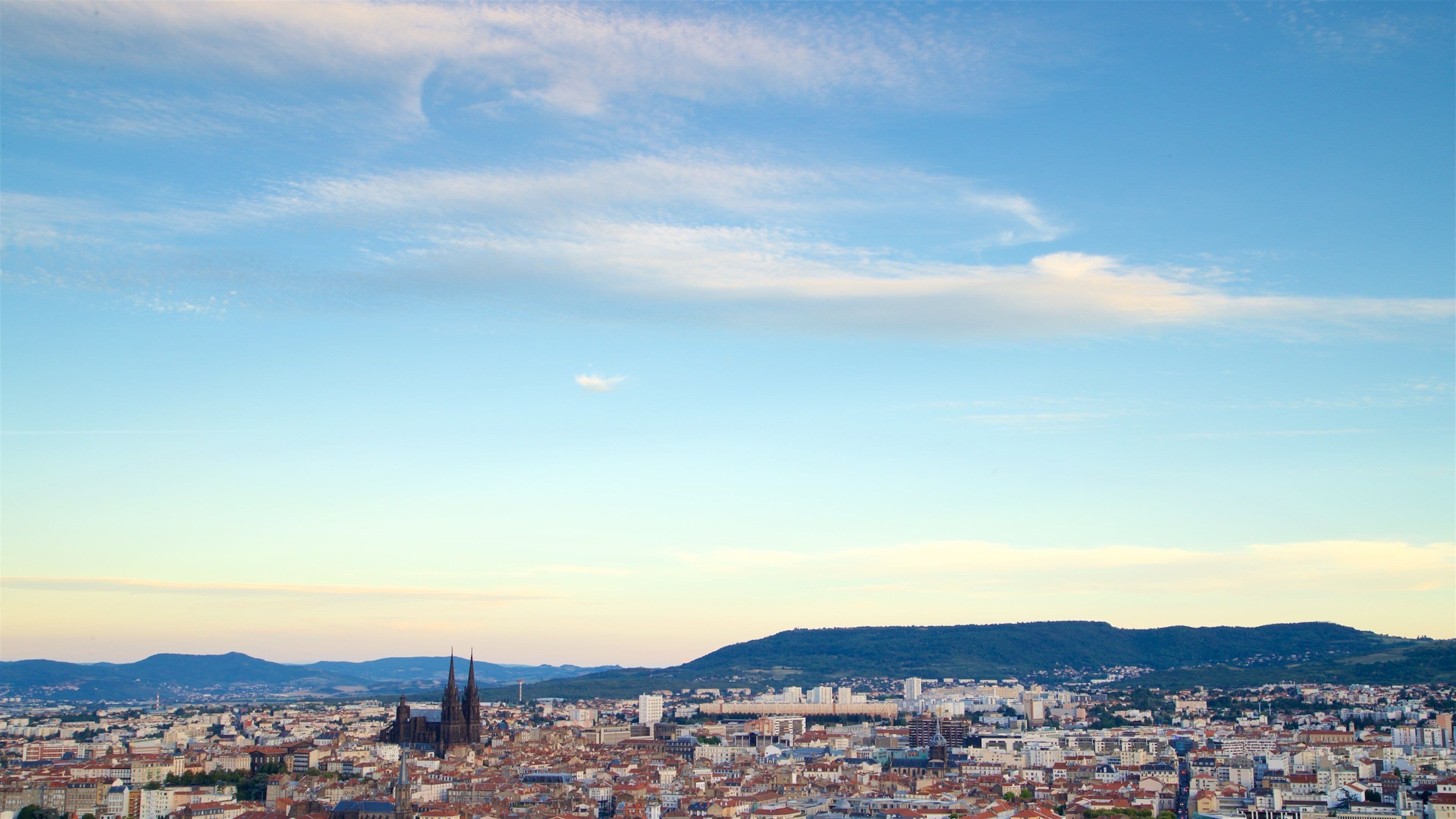 Montjuzet Park which includes a city, landscape views and a sunset
