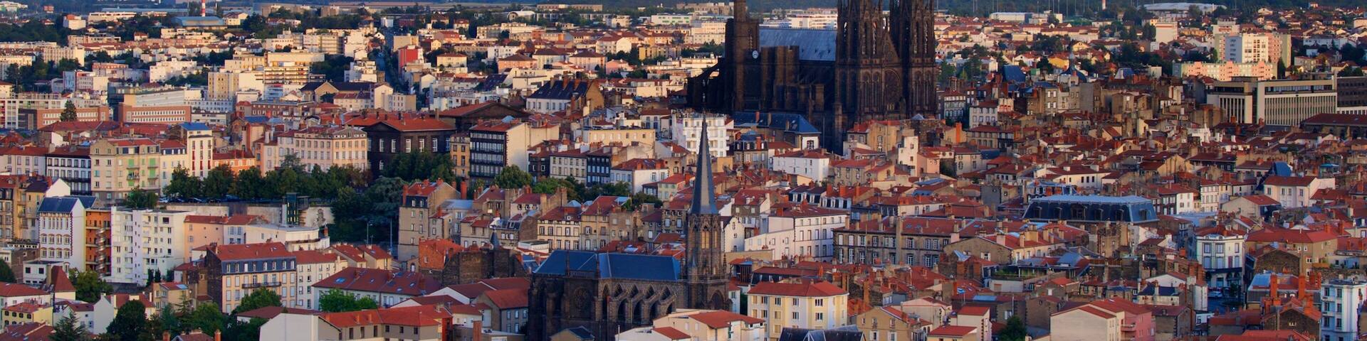 Montjuzet Park featuring landscape views, a city and a church or cathedral