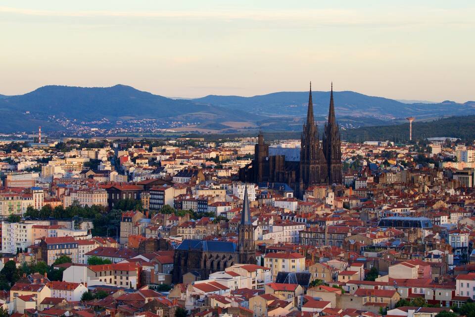 A cityscape with a prominent cathedral and surrounding buildings.