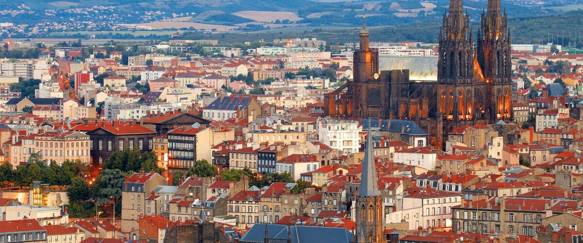 Montjuzet Park showing a church or cathedral, a city and heritage architecture