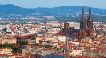 Montjuzet Park showing landscape views, a church or cathedral and heritage architecture